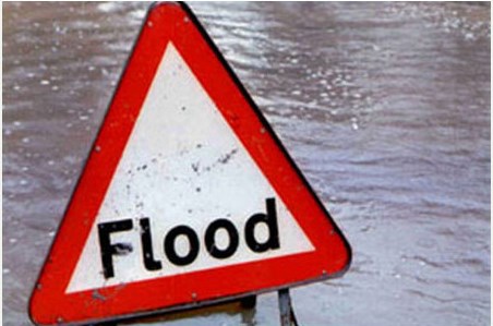 Flood waters and sign